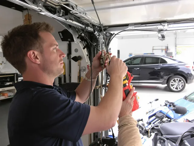East Cleveland Garage Door Repair safety certified technician performing cable replacement in East Cleveland