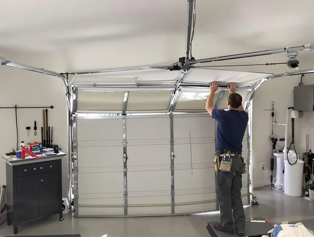 East Cleveland Garage Door Repair specialist performing precise section replacement on East Cleveland garage door